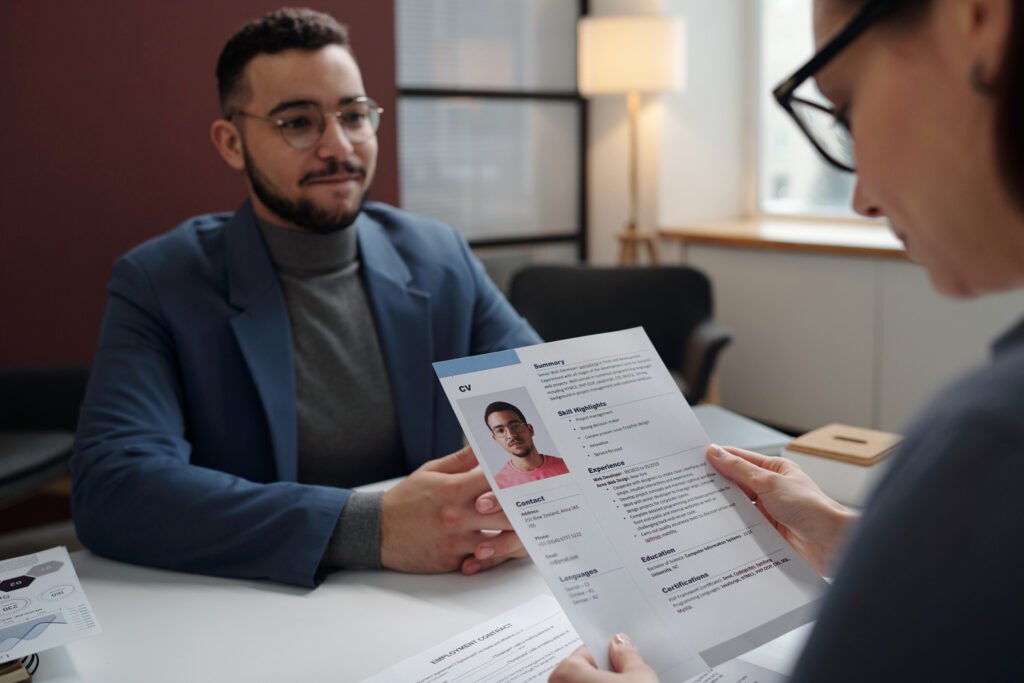 recruiter holding cv during job interview